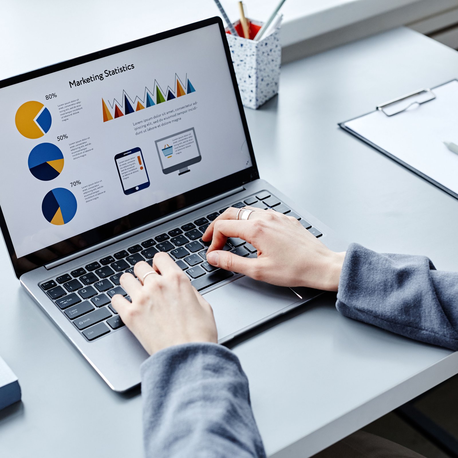 Marketing analyst reviewing engagement data on a laptop